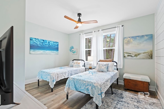 bedroom with hardwood / wood-style flooring and ceiling fan