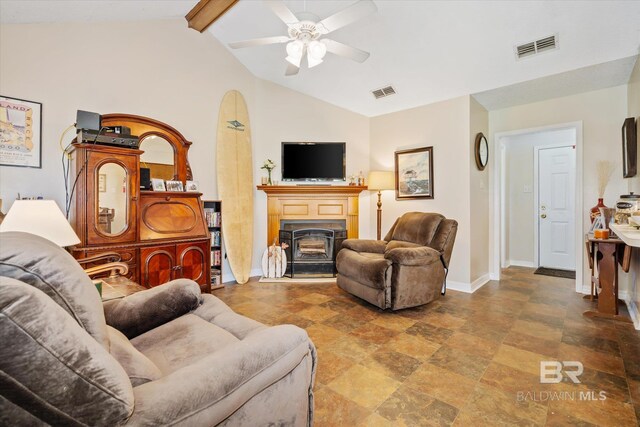 tiled living room with ceiling fan and lofted ceiling with beams