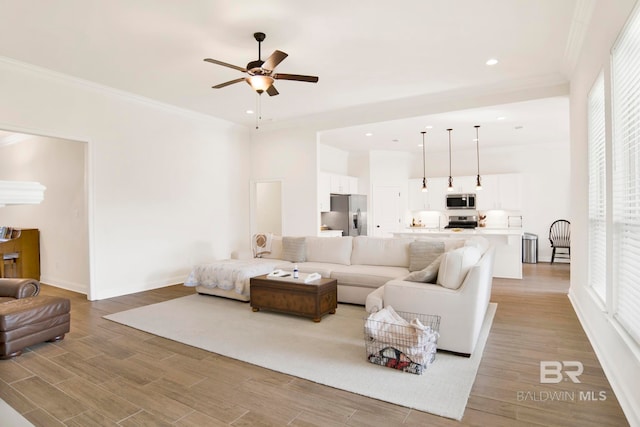 22258 Hibiscus Cir, Foley, AL 36535 - living area with recessed lighting, ceiling fan, light wood-style floors, and ornamental molding
