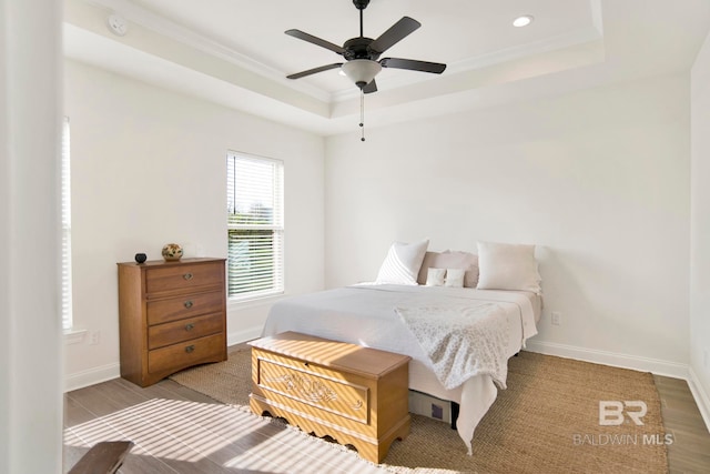 22258 Hibiscus Cir, Foley, AL 36535 - bedroom with a tray ceiling, baseboards, and crown molding