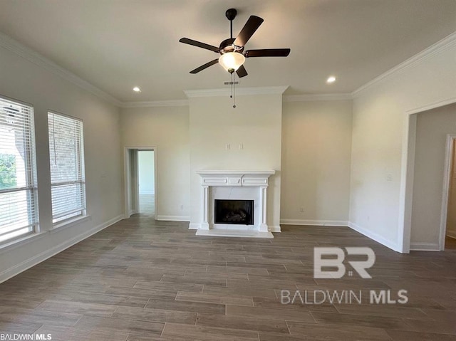 22258 Hibiscus Cir, Foley, AL 36535 - unfurnished living room featuring crown molding, wood finished floors, baseboards, and ceiling fan
