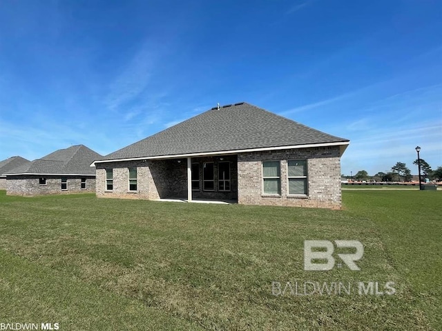 22258 Hibiscus Cir, Foley, AL 36535 - back of property featuring a yard and brick siding