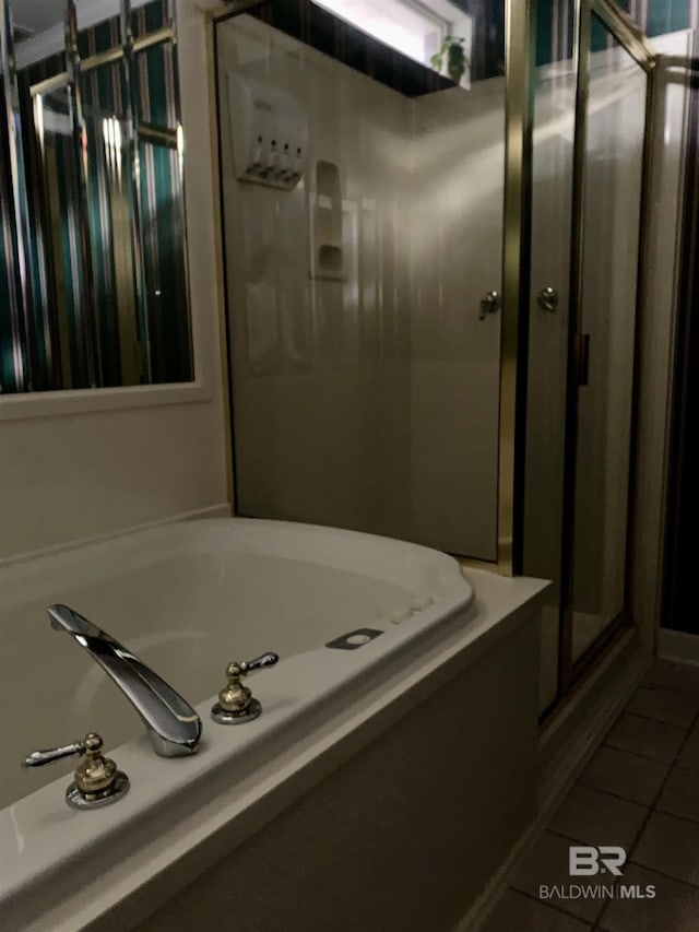 bathroom featuring tile patterned flooring and walk in shower