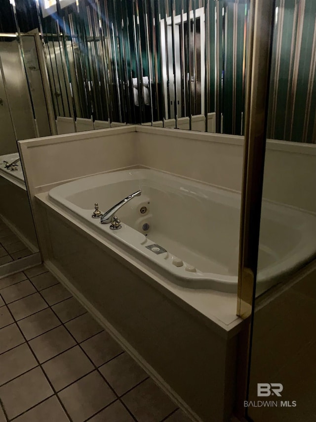 bathroom featuring tile patterned flooring and a bathtub