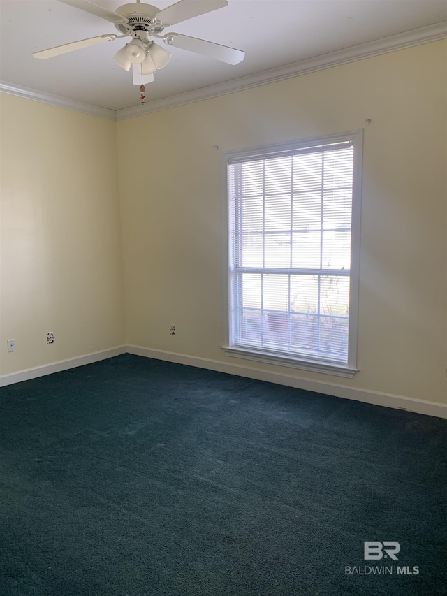 carpeted empty room featuring ornamental molding and ceiling fan