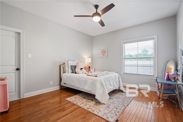 bedroom with hardwood / wood-style floors and ceiling fan