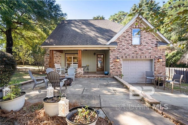 view of front of home with a garage and covered porch