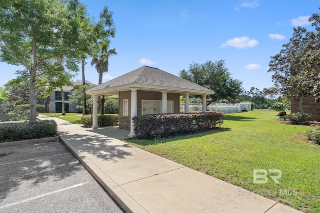 450 Park Ave Unit 112, Foley, AL 36535 - view of property's community featuring mail area, uncovered parking, and a lawn