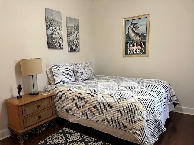 450 Park Ave Unit 112, Foley, AL 36535 - bedroom with wood finished floors and baseboards