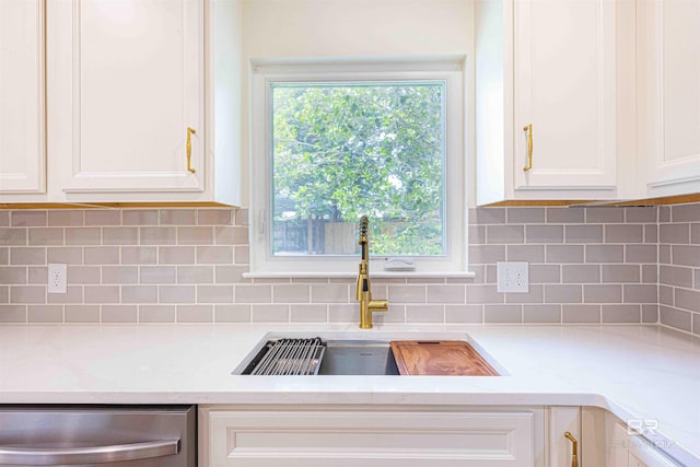 362 Azalea St, Fairhope, AL 36532 - kitchen view of a sink, dishwasher, light countertops, and white cabinetry