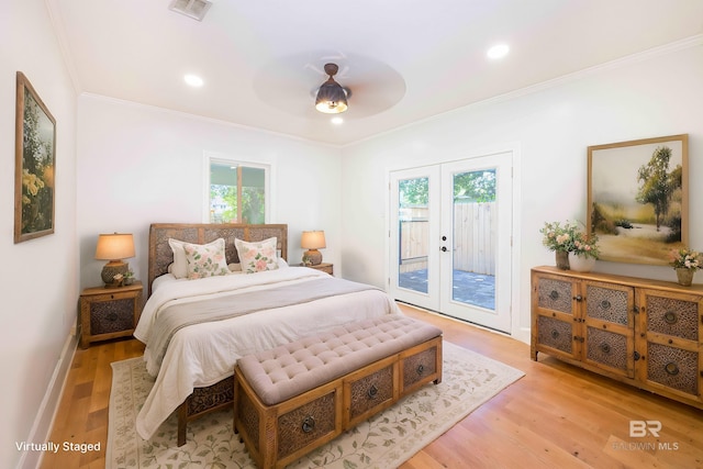 362 Azalea St, Fairhope, AL 36532 - bedroom featuring access to outside, multiple windows, ornamental molding, french doors, and light wood-style flooring