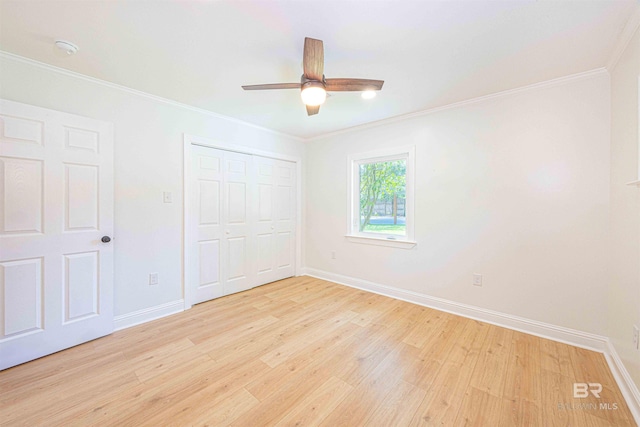 362 Azalea St, Fairhope, AL 36532 - unfurnished bedroom with light wood-style floors, baseboards, a closet, ornamental molding, and ceiling fan