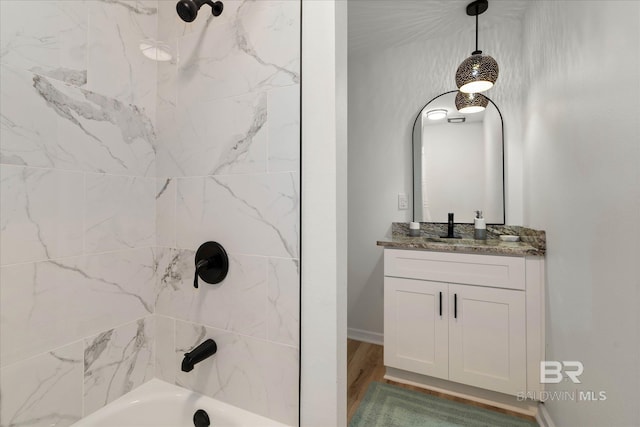 bathroom featuring shower / bath combination and vanity