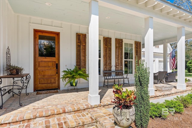 property entrance with covered porch