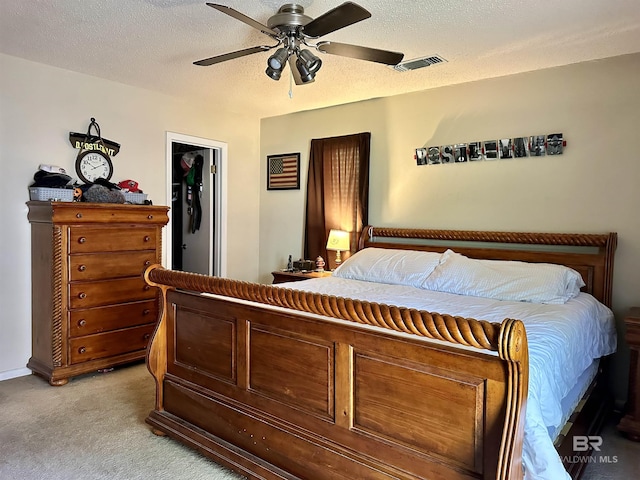 1802 Brookwood Dr, Brewton, AL 36426 - bedroom featuring light colored carpet, visible vents, a ceiling fan, and a textured ceiling