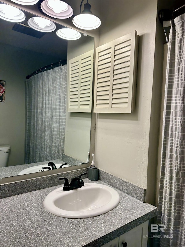 1802 Brookwood Dr, Brewton, AL 36426 - bathroom featuring toilet and vanity