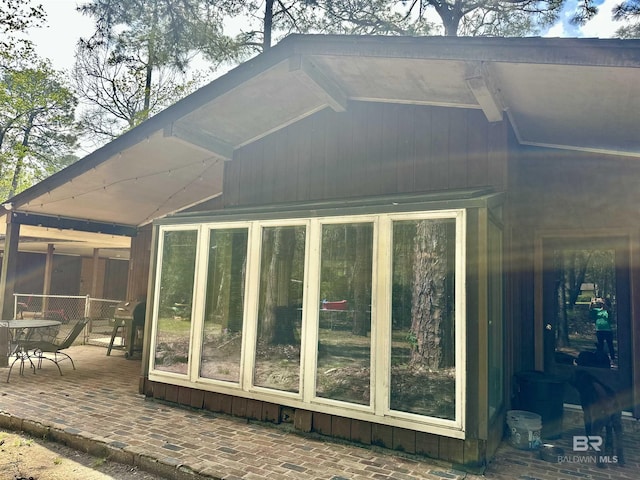 1802 Brookwood Dr, Brewton, AL 36426 - exterior space with a sunroom and a patio area