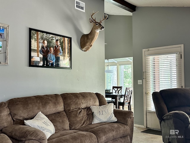 1802 Brookwood Dr, Brewton, AL 36426 - living area featuring visible vents, beamed ceiling, and light colored carpet