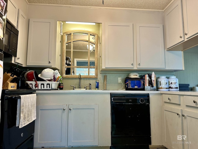 1802 Brookwood Dr, Brewton, AL 36426 - kitchen with a textured ceiling, light countertops, white cabinetry, a sink, and black appliances