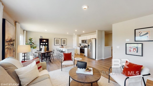 17806 Hens Ave, Foley, AL 36535 - living area featuring light wood finished floors, recessed lighting, and baseboards