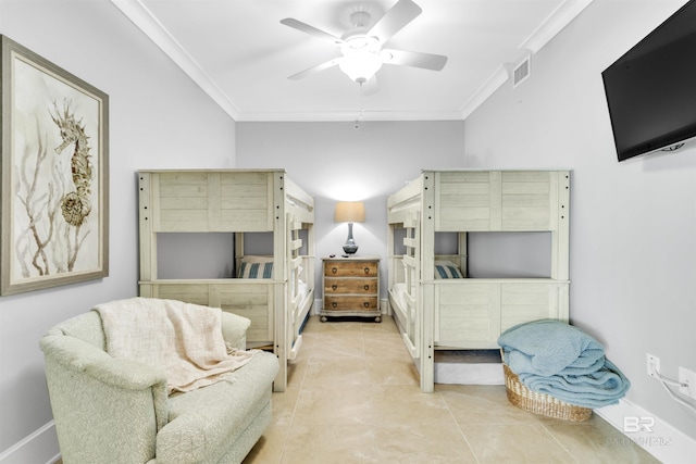 tiled bedroom with ceiling fan and crown molding