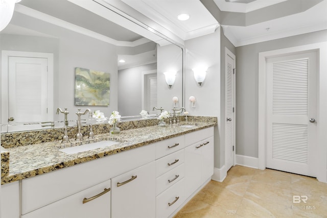 bathroom featuring vanity and ornamental molding