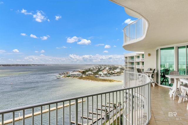 balcony featuring a water view