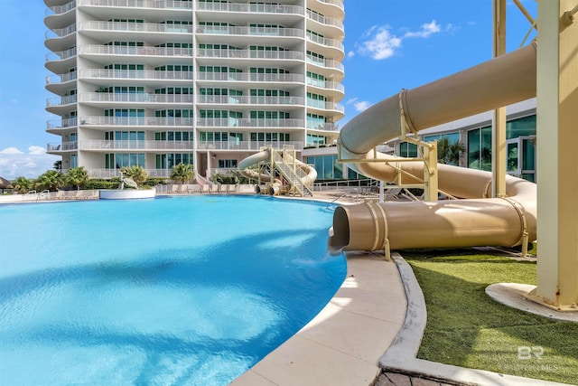 view of pool featuring a water slide