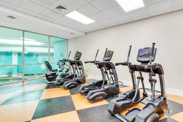 gym featuring a paneled ceiling