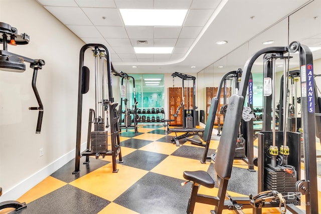 workout area with a drop ceiling