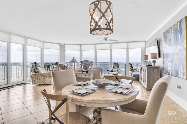 dining space featuring light tile patterned flooring and a wealth of natural light