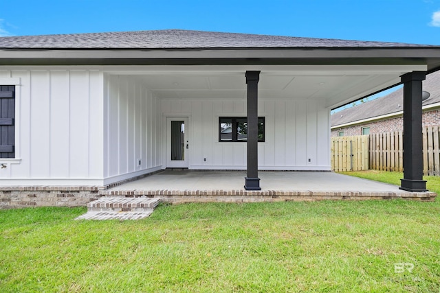 exterior space with a lawn and a patio area