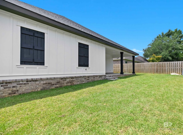 view of home's exterior with a yard