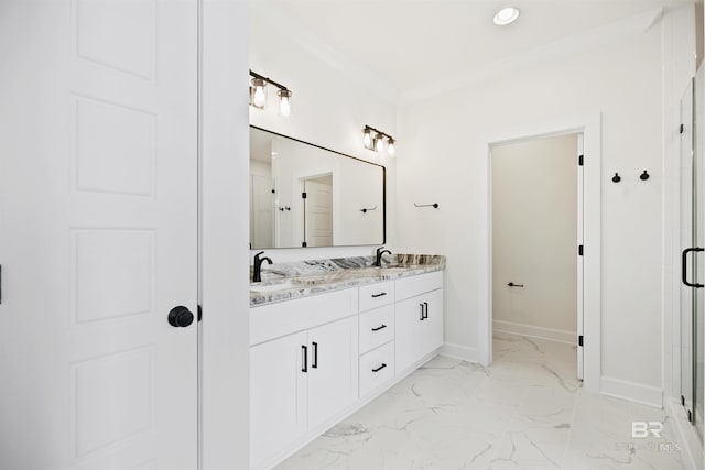 bathroom featuring a shower with shower door, vanity, and crown molding