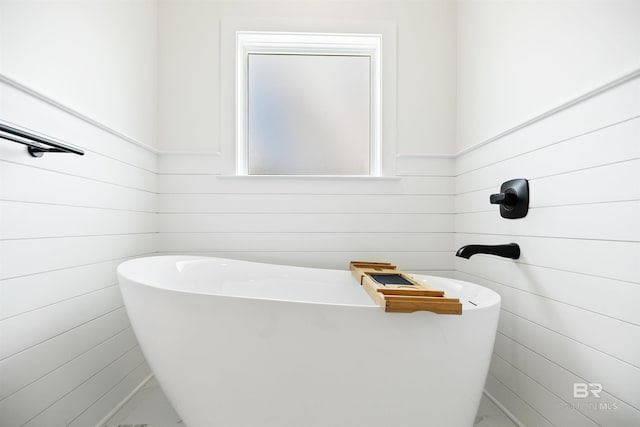 bathroom with a tub