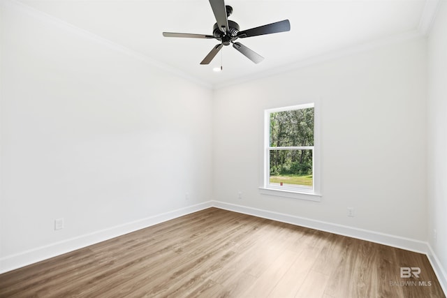 unfurnished room with ceiling fan, hardwood / wood-style floors, and crown molding