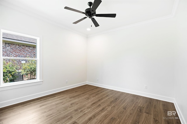 spare room with ceiling fan, dark hardwood / wood-style floors, and crown molding