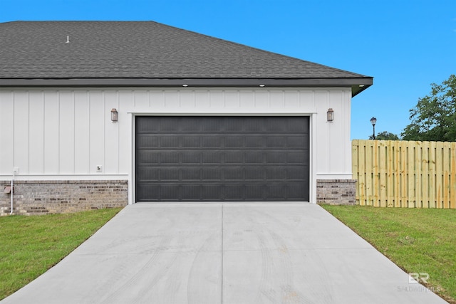 garage featuring a yard