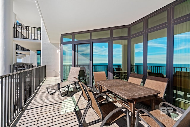 balcony featuring a water view