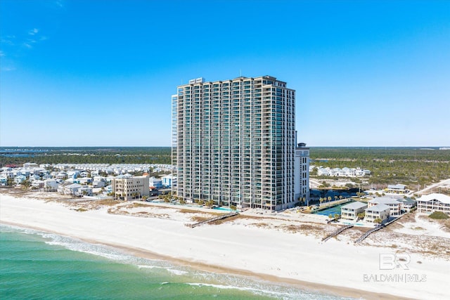 drone / aerial view with a water view and a view of the beach