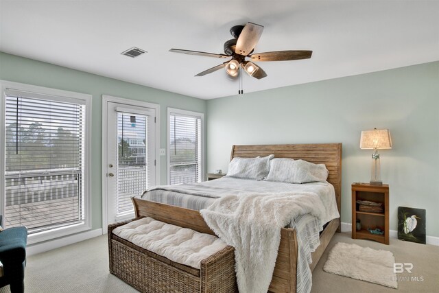 carpeted bedroom with access to outside and ceiling fan