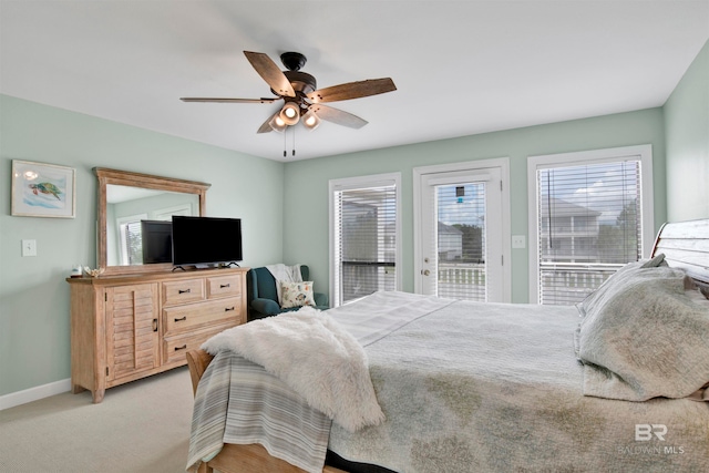 bedroom with access to outside, light carpet, and ceiling fan