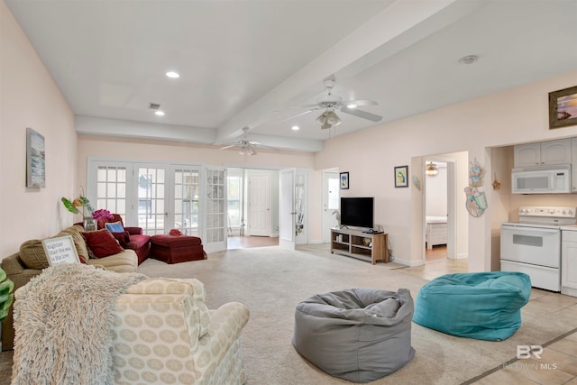 living room featuring light tile patterned floors, beam ceiling, ceiling fan, and french doors