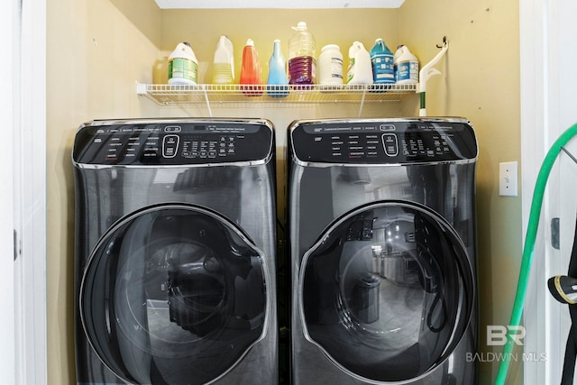 washroom with washing machine and dryer