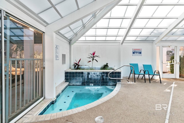 view of pool with a patio area and a lanai