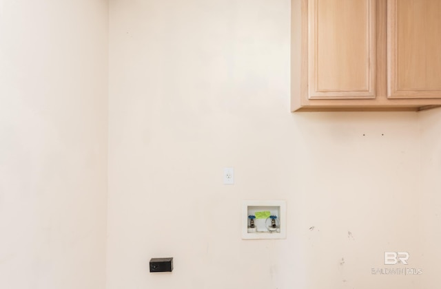 laundry room with hookup for a washing machine and cabinet space