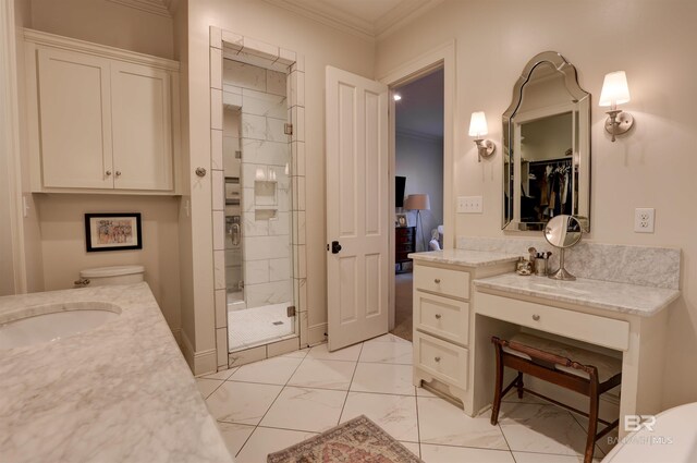 full bathroom featuring vanity, ornamental molding, a shower stall, a closet, and marble finish floor