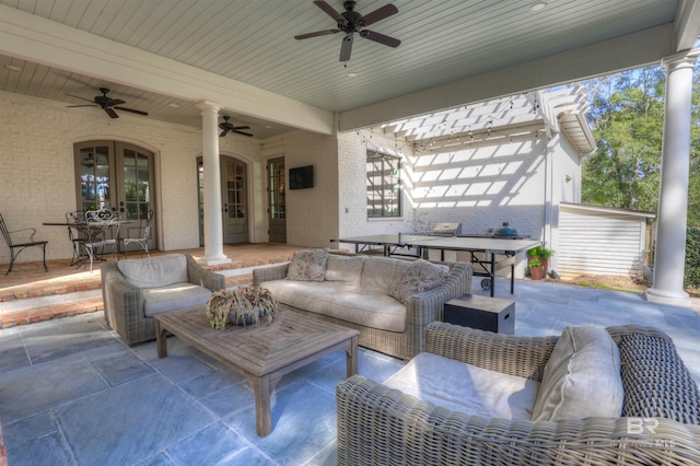 view of patio featuring outdoor dining space, french doors, outdoor lounge area, and ceiling fan