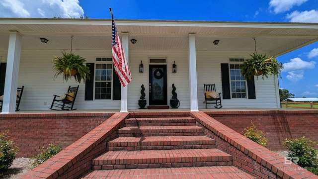 entrance to property with covered porch