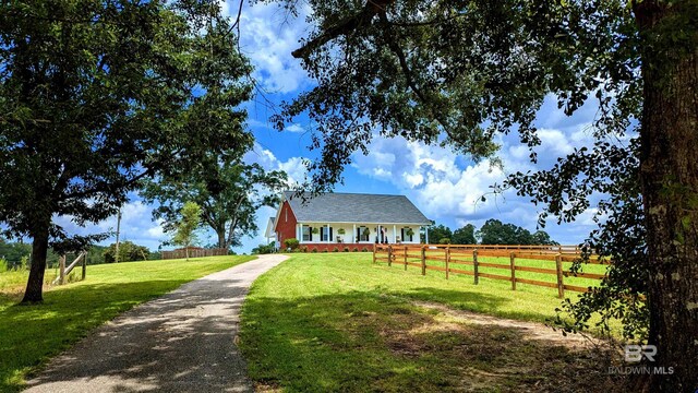 view of front of property featuring a rural view and a front yard